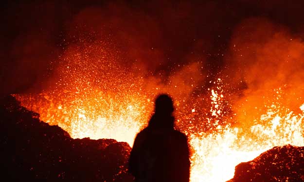 Woman Standing in Front of Hot Lava.